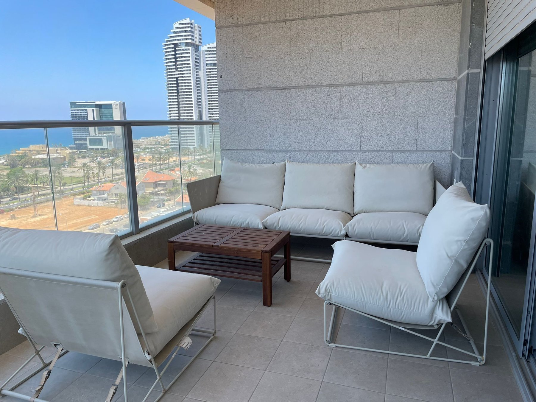 Designer terrace furniture overlooking Netanya skyline