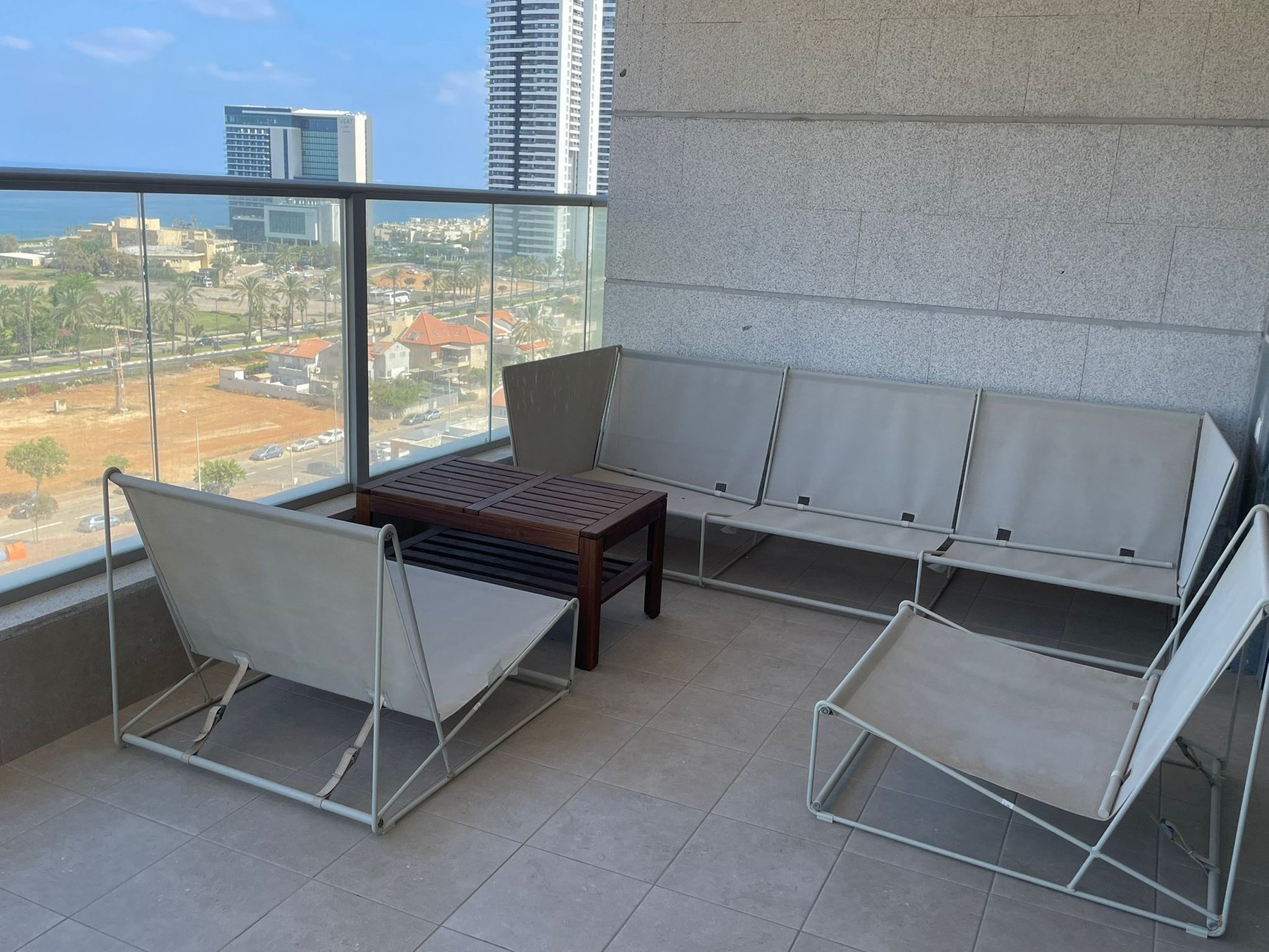 Balcony with Mediterranean view and minimalist seating
