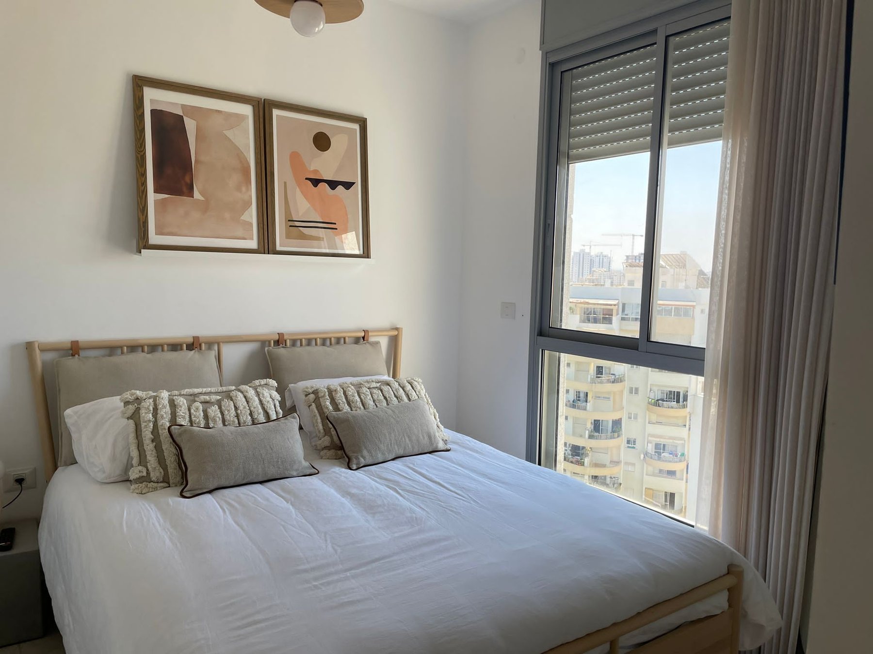 Third bedroom with framed art