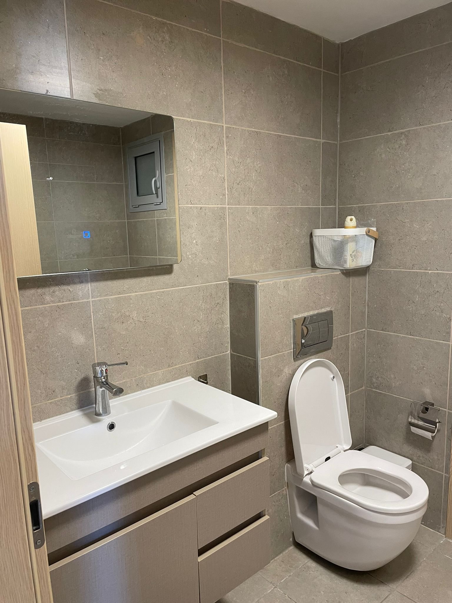 Modern bathroom with stone tiles