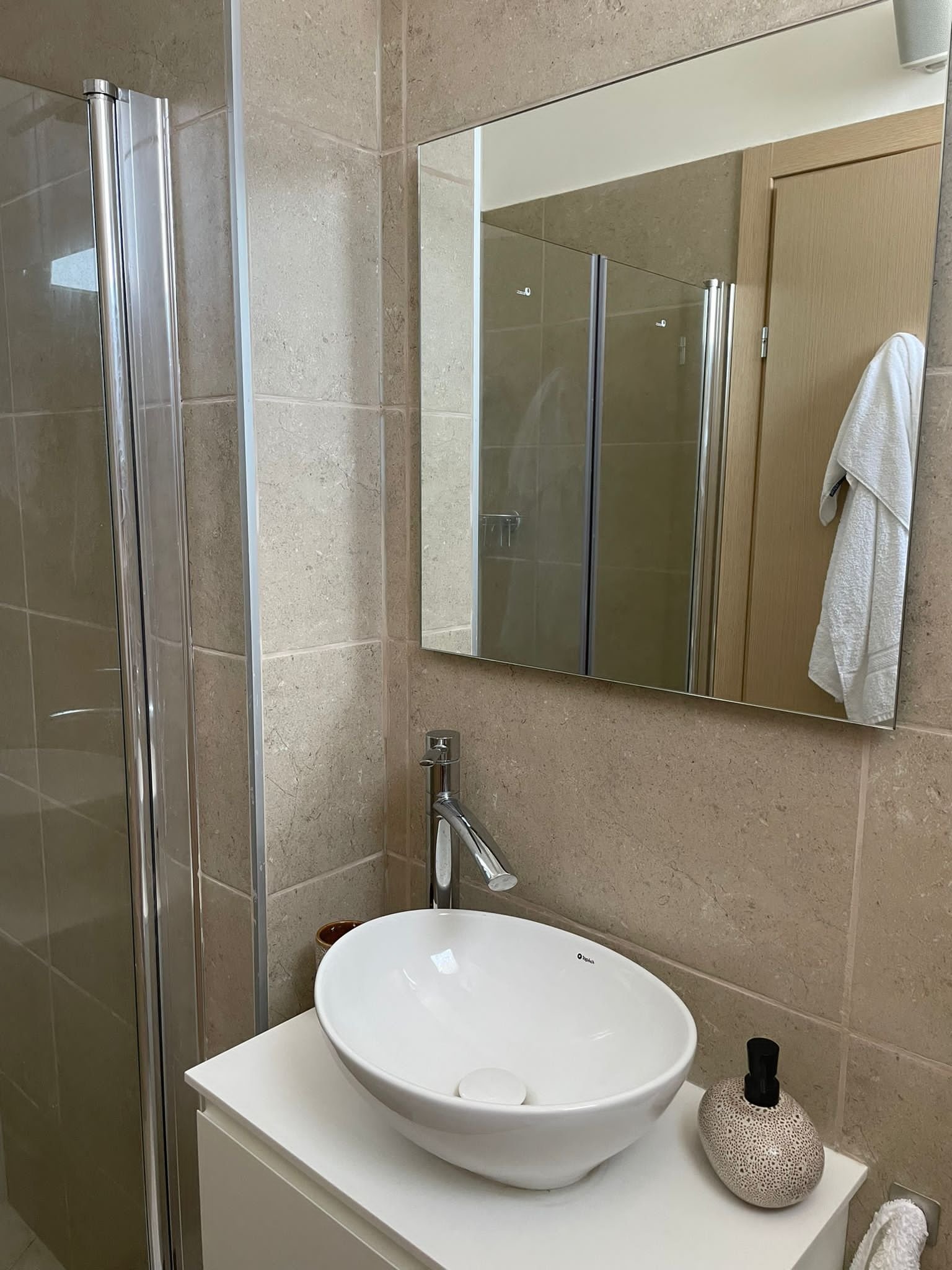 Designer vessel basin and walk-in shower